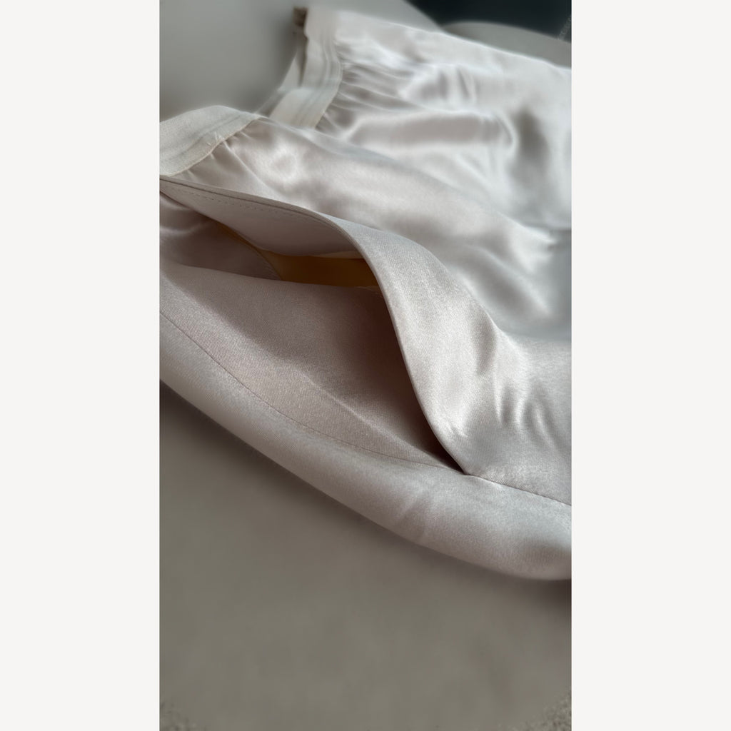 Close-up of white fabric on a light gray background